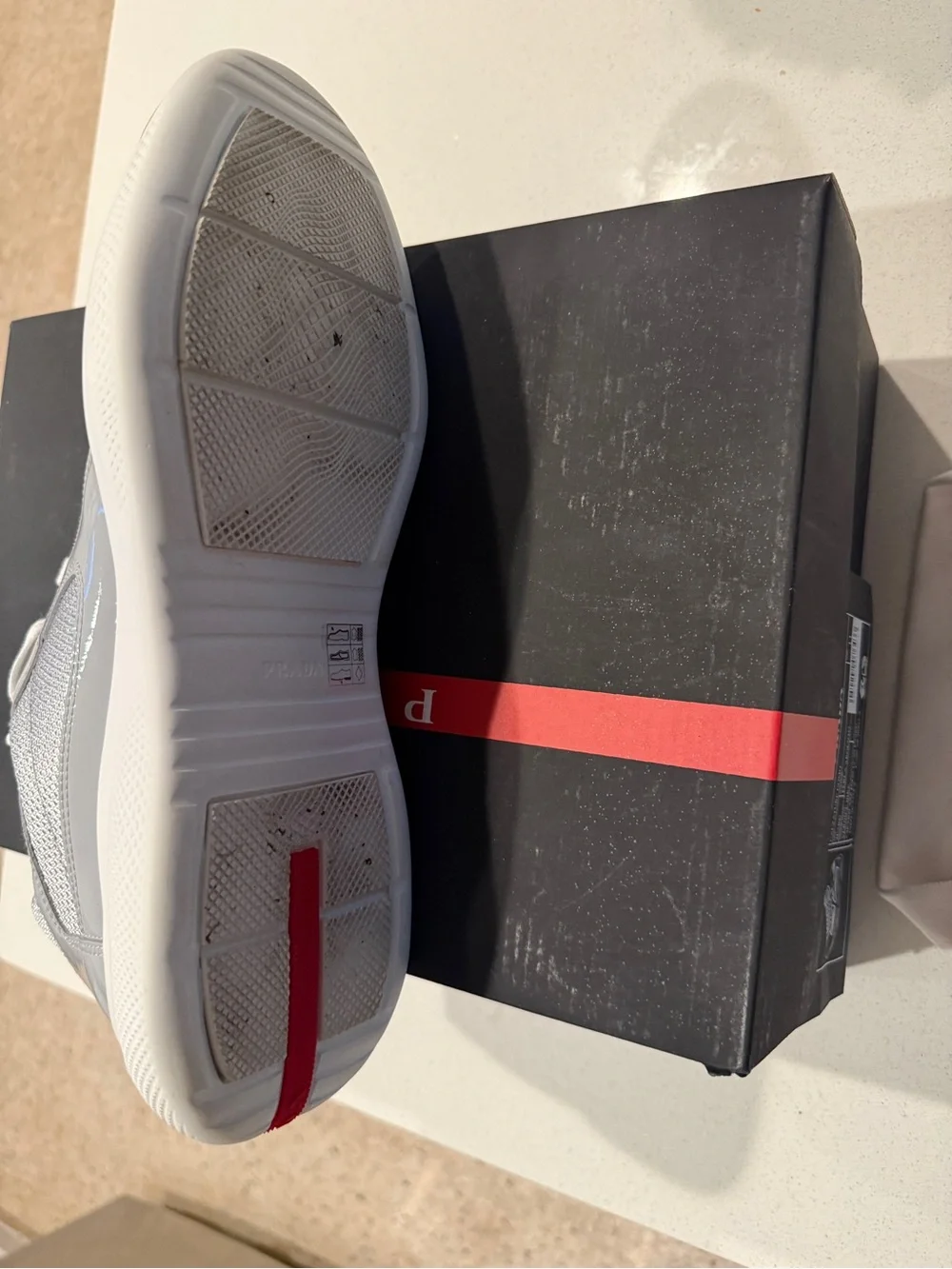 Prada Men’s Light Gray and White Lace-Up Sneakers with Red Logo Tape